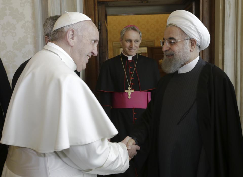 Pope Francis shakes hands with Iranian President Hassan Rouhani, right, on the occasion of their private audience at the Vatican,Tuesday, Jan. 26, 2016. Irans president has paid a call on Pope Francis at the Vatican during a European visit aimed at positioning Tehran as a potential top player in efforts to resolve Middle East conflicts, including Syrias civil war. (AP Photo/Andrew Medichini, Pool)