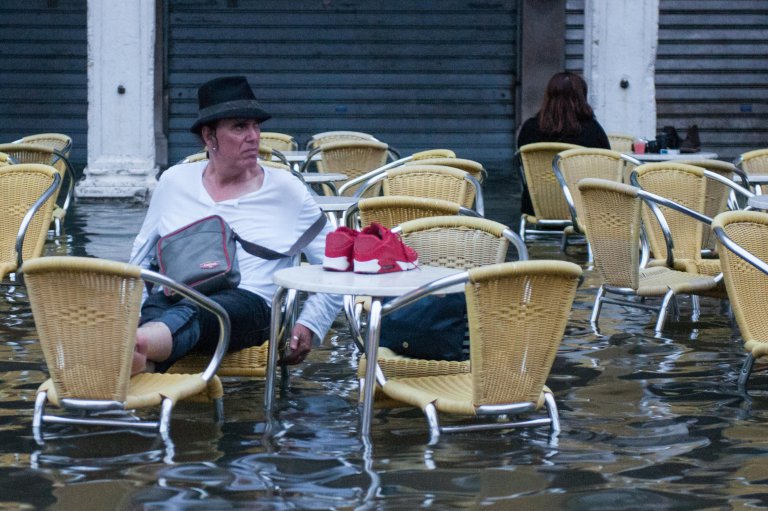 Alamy Live News. G421XN Venice, Italy. 16th June, 2016. VENICE, ITALY - June 15: A man sits on a chair in the water in St. Mark square during the high tide on June 15, 2016 in Venice, Italy. The high water in this period is exceptional, and it is a surprise for citizen and tourists. HOW TO LICENCE THIS PICTURE: please contact us via e-mail at sales@xianpix.com or call 44 (0)207 1939846 for prices and terms of copyright. First Use Only, Editorial Use Only, All repros payable, No Archiving. © Awakening/Xianpix © Simone Padovani /Awakening/Alamy Live News This is an Alamy Live News image and may not be part of your current Alamy deal . If you are unsure, please contact our sales team to check.