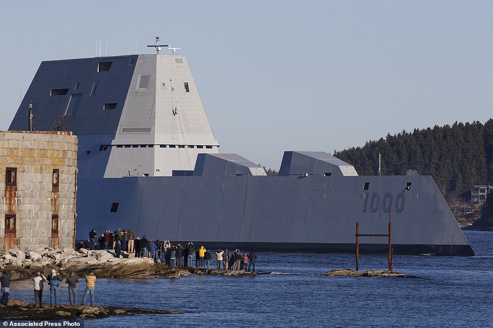 The first Zumwalt-class destroyer, USS Zumwalt, the largest ever built for the U.S. Navy, passes spectators at Fort Popham at the mouth of the Kennebec River in Phibbsburg, Maine, Monday, Dec. 7, 2015, in Bath, Maine. The ship is headed out to sea for the first time to undergo sea trials. (AP Photo/Robert F. Bukaty)