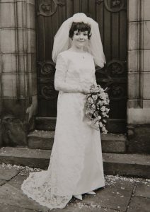 Margaret White, with husband Michael White on their wedding day, 1966. Connie ditched her wedding dress for her  grandma's 50 year old floral lace number. See rossparry copy RPYDRESS:A beautiful bride ditched her expensive wedding dress on the big day after falling in love with her grandmother's 50-year-old floral lace number. Connie Bell, 21, nee Pickup, decided to keep her £1,000 "simple" wedding dress in reserve for her special day for the same dress her granny Margaret White, 71, wore on her wedding day in 1966 - and it was a perfect fit. When bride Connie was told her wedding venue had been cancelled two weeks before her wedding - her grandmother decided to cheer her up by showing her the dress she wore.