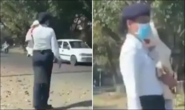 Çudit policja në Indi, kontrollon trafikun e renduar me foshnjën në krahë (VIDEO)